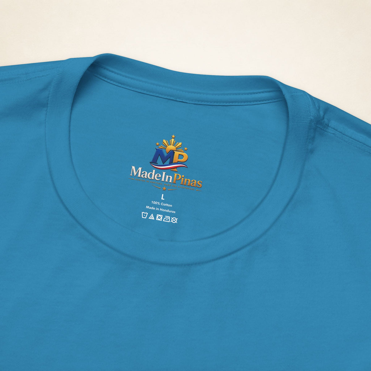 Close-up of the Aqua ATE T-shirt collar showing the printed MadeInPinas inner-neck logo.