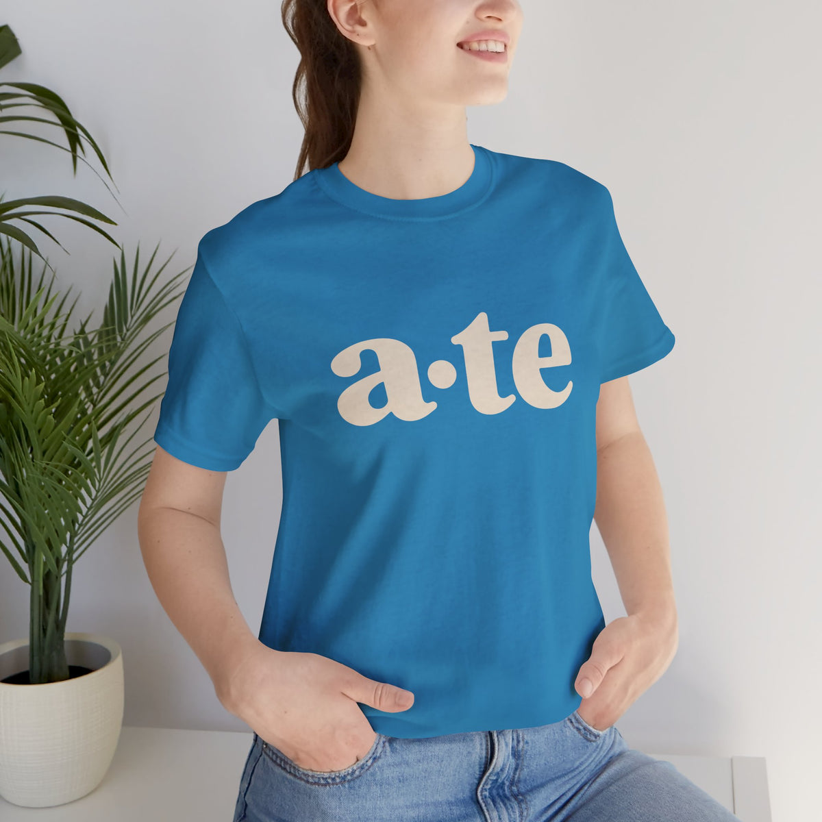 Lifestyle front view of a model wearing the Aqua ATE Filipino T-shirt with minimalist a·te lettering.