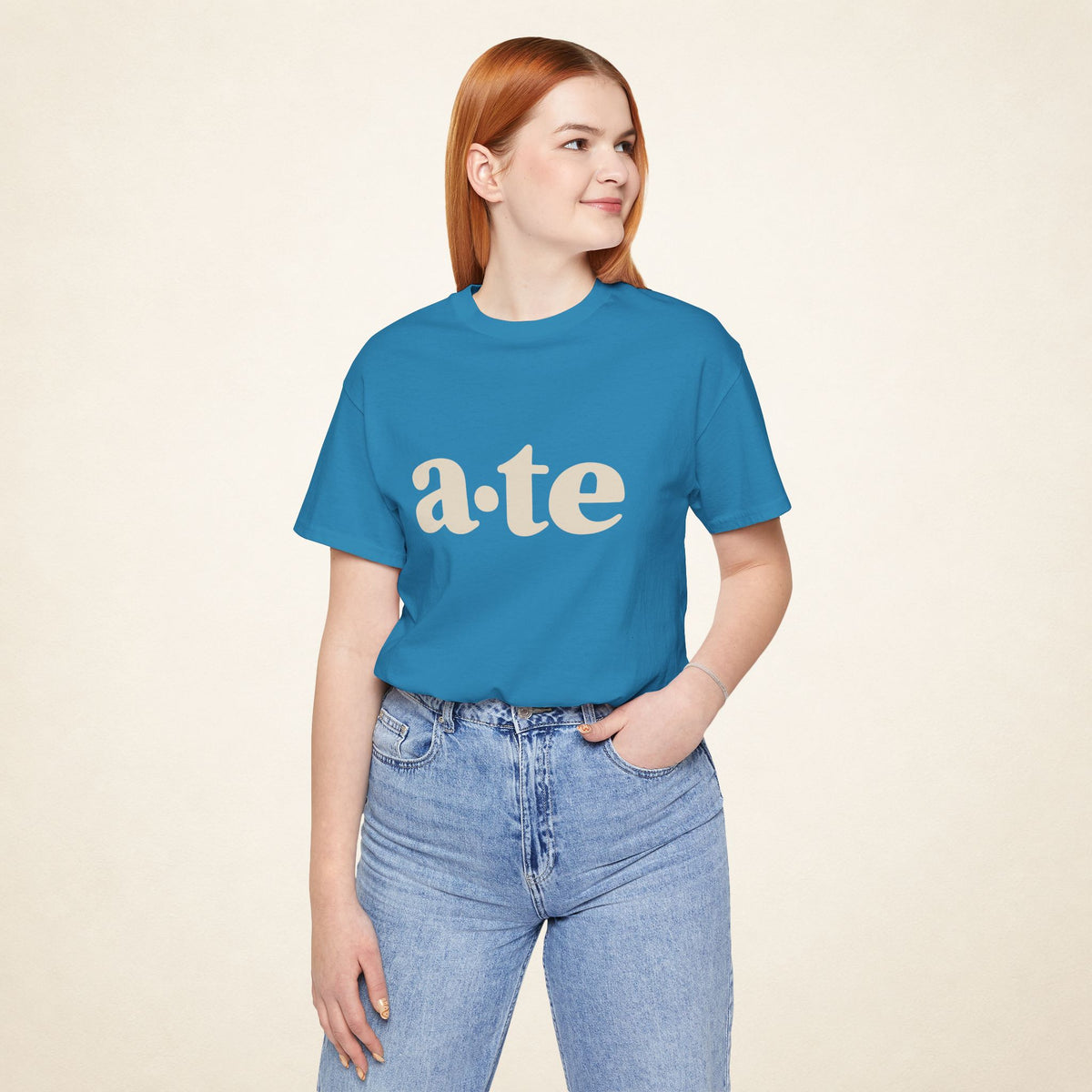Model wearing the Aqua ATE Filipino T-shirt from MadeInPinas, front view showing a·te lettering.
