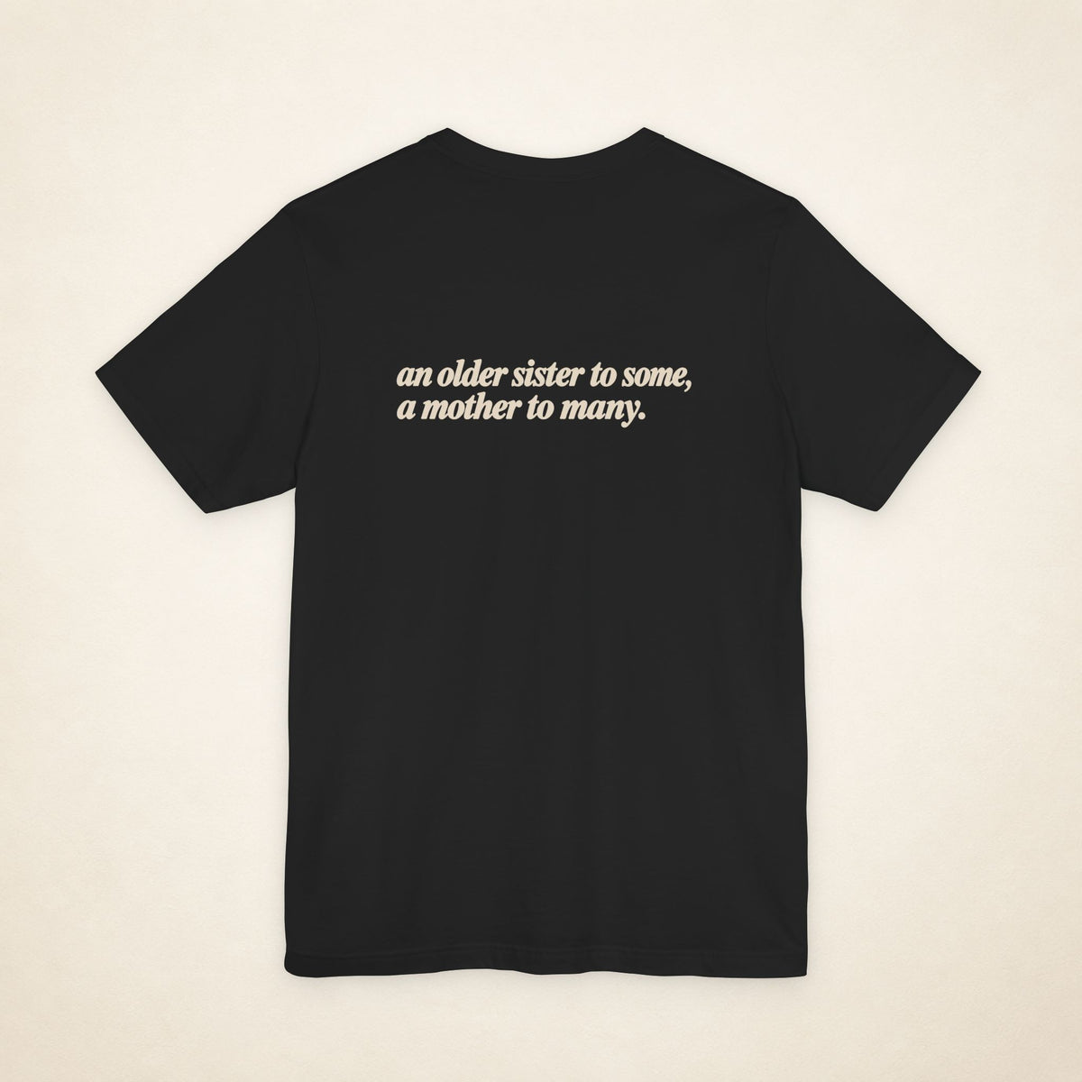 Black ATE Filipino T-shirt, flat-lay back view with the message “an older sister to some, a mother to many.”