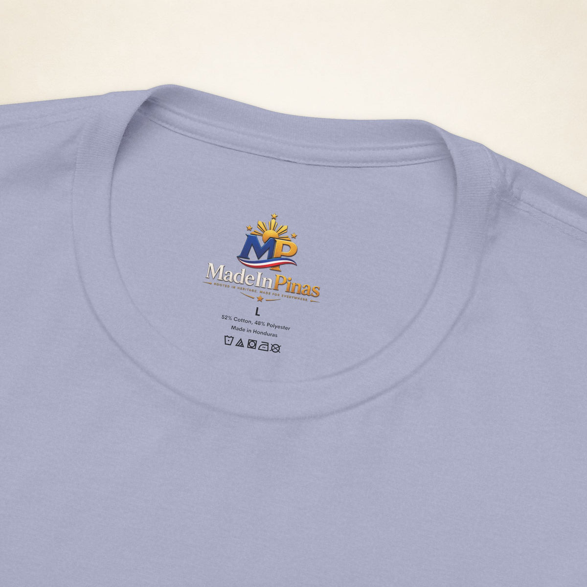 Close-up of the Heather Blue ATE T-shirt collar showing the printed MadeInPinas inner-neck logo.