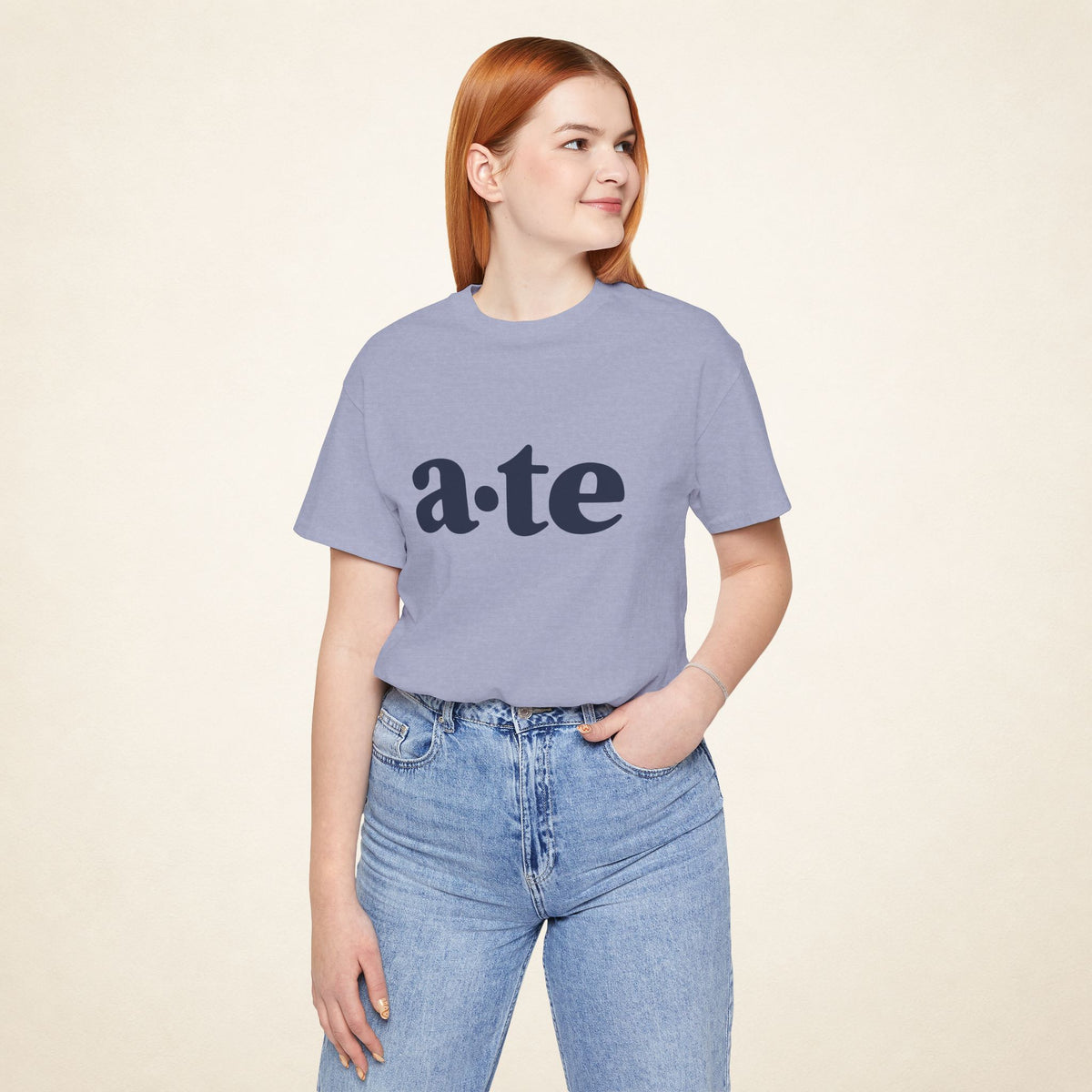 Model wearing the Heather Blue ATE Filipino T-shirt from MadeInPinas, front view showing a·te lettering.