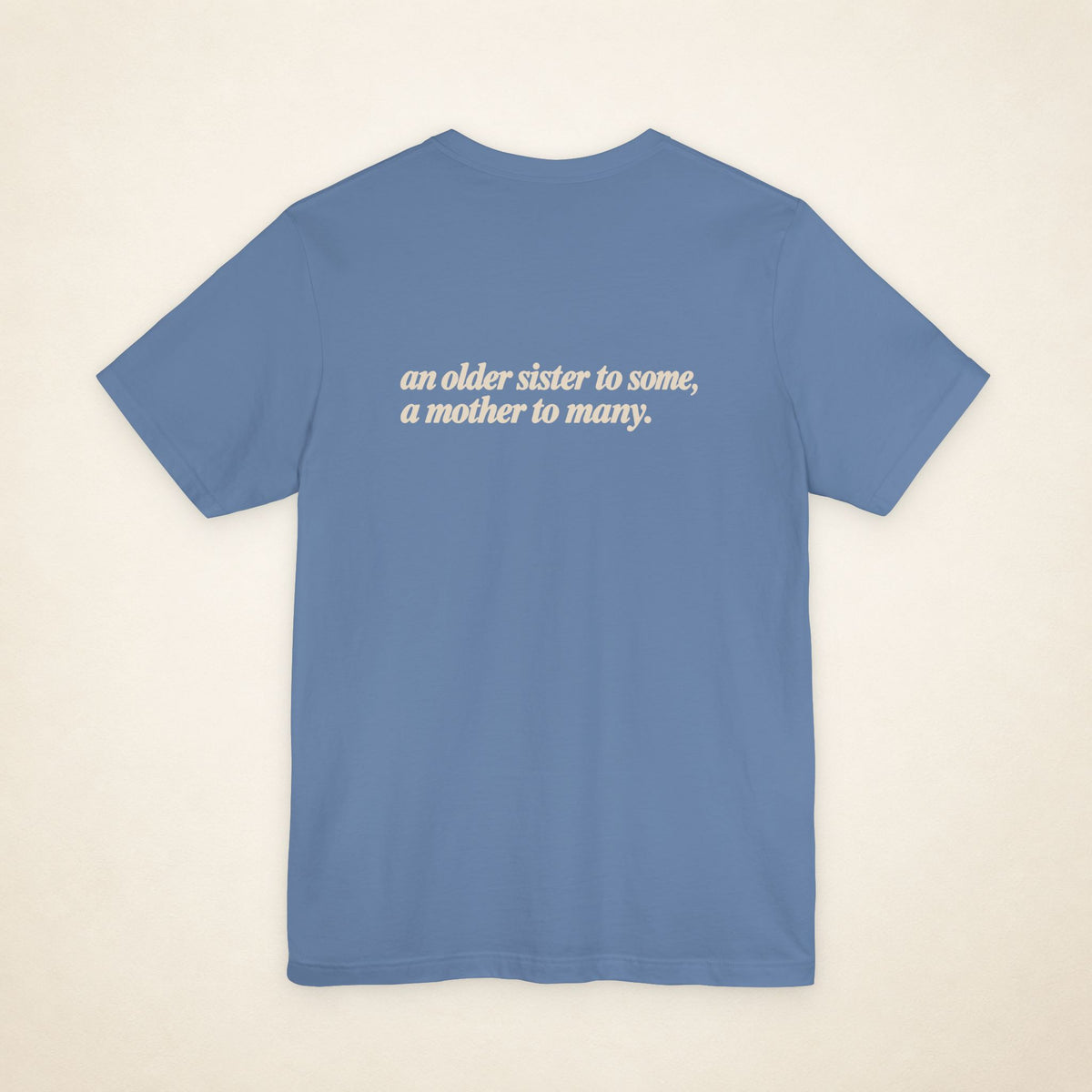 Lavender Blue ATE Filipino T-shirt, flat-lay back view with the message “an older sister to some, a mother to many.”