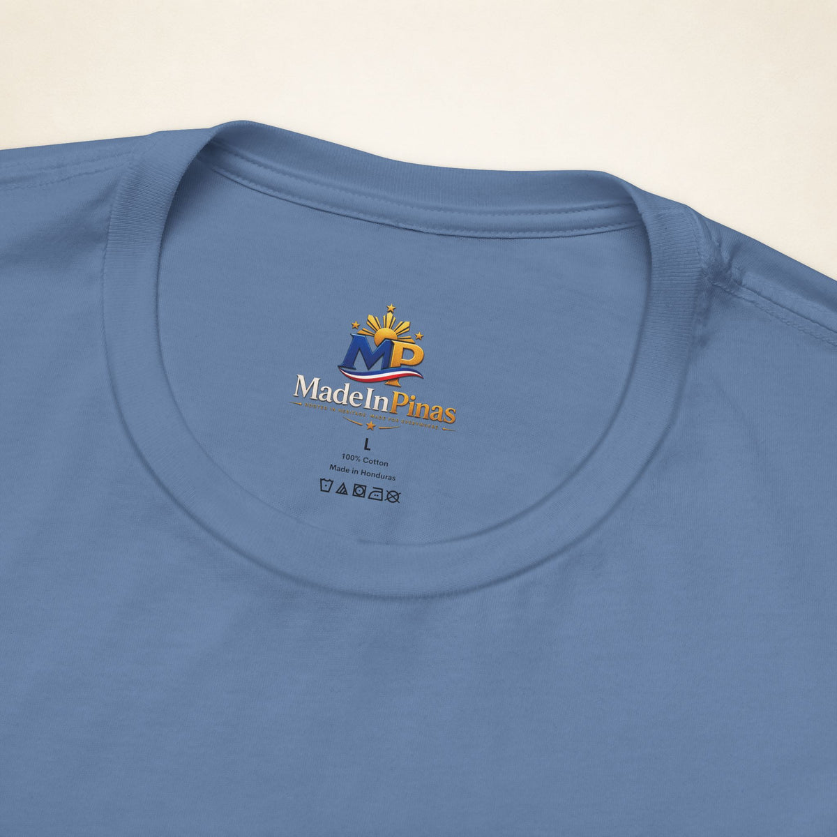 Close-up of the Lavender Blue ATE T-shirt collar showing the printed MadeInPinas inner-neck logo.