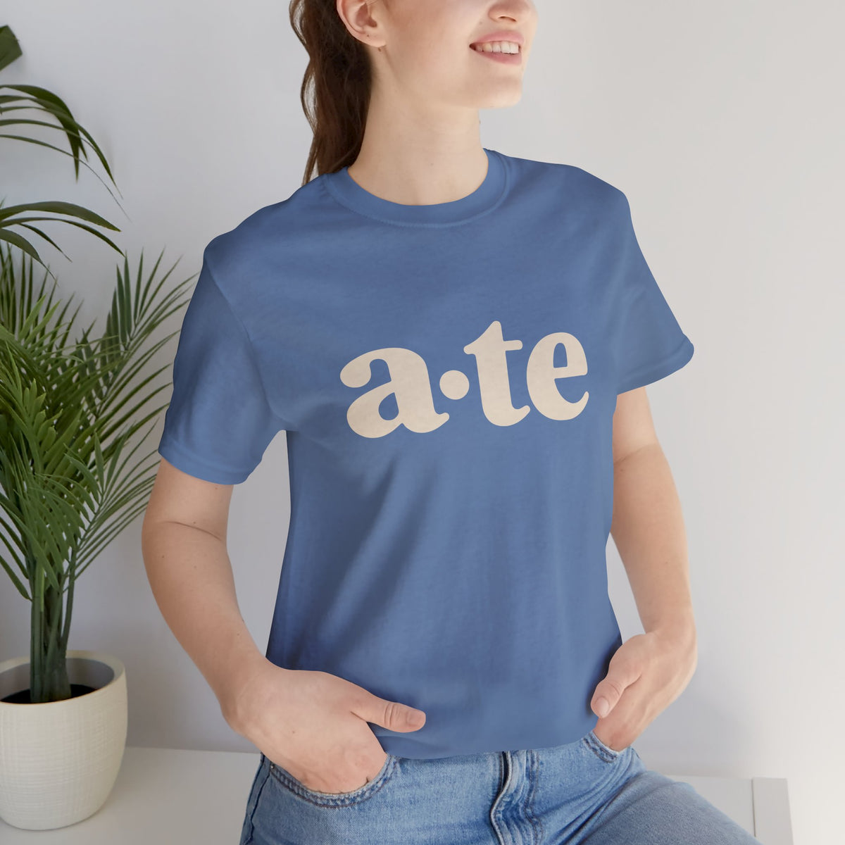Lifestyle front view of a model wearing the Lavender Blue ATE Filipino T-shirt with minimalist a·te lettering.