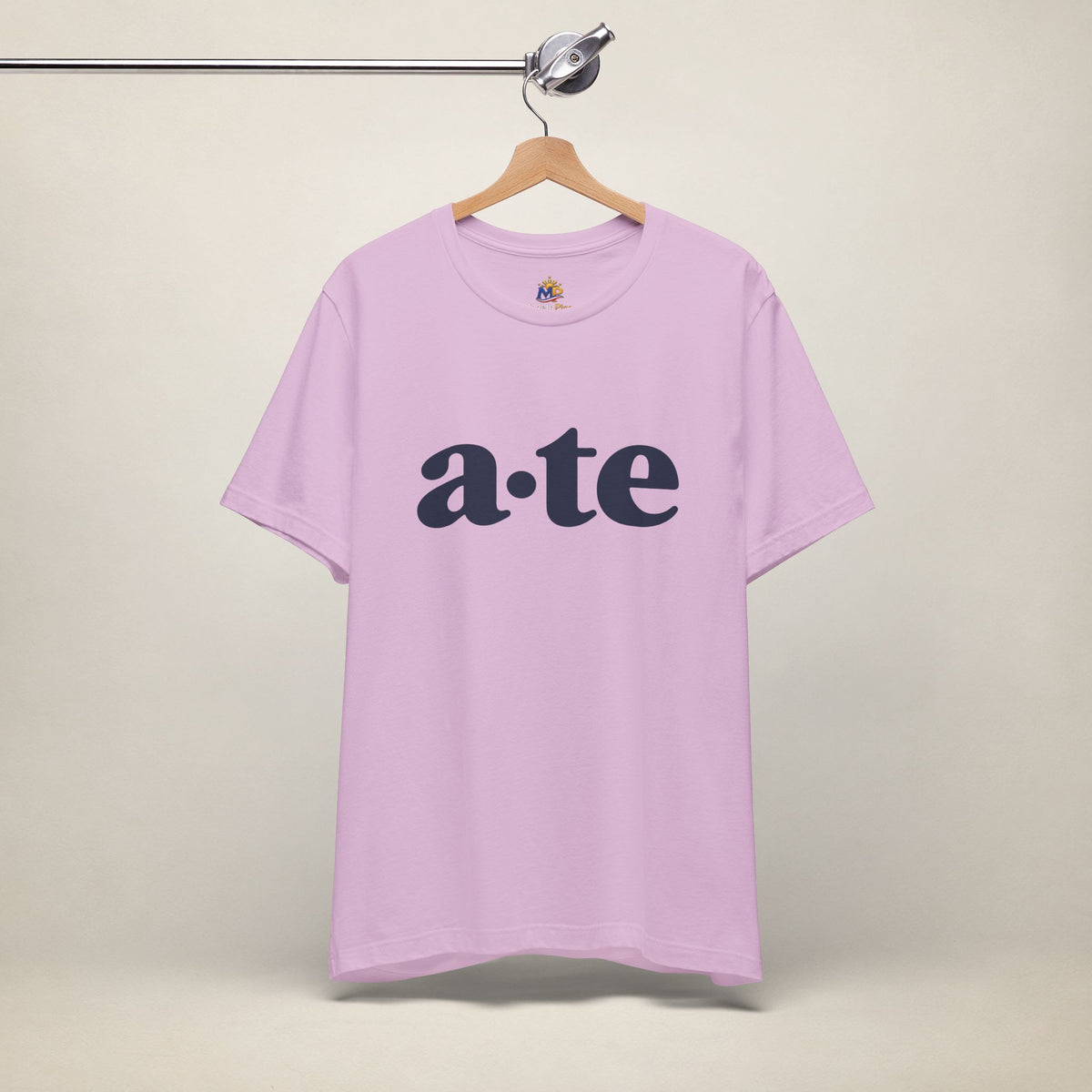 Lilac MadeInPinas ATE Filipino T-shirt on a hanger, front view with minimalist a·te lettering.