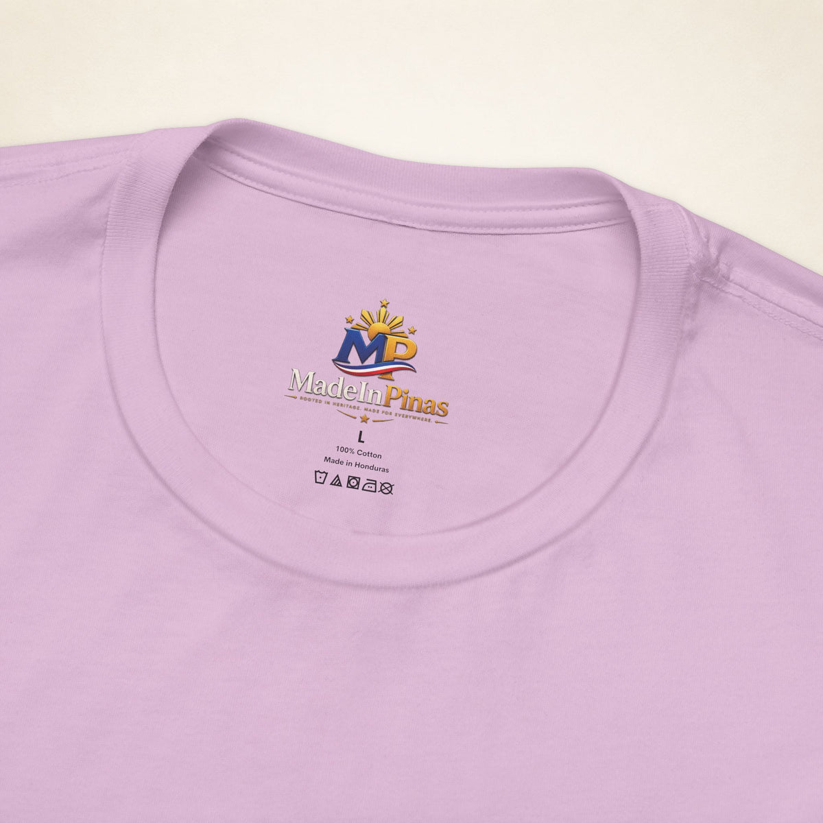 Close-up of the Lilac ATE T-shirt collar showing the printed MadeInPinas inner-neck logo.