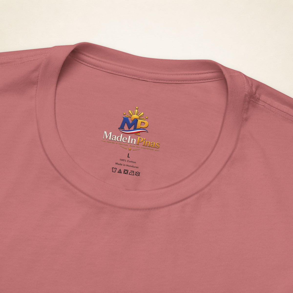 Close-up of the Mauve ATE T-shirt collar showing the printed MadeInPinas inner-neck logo.