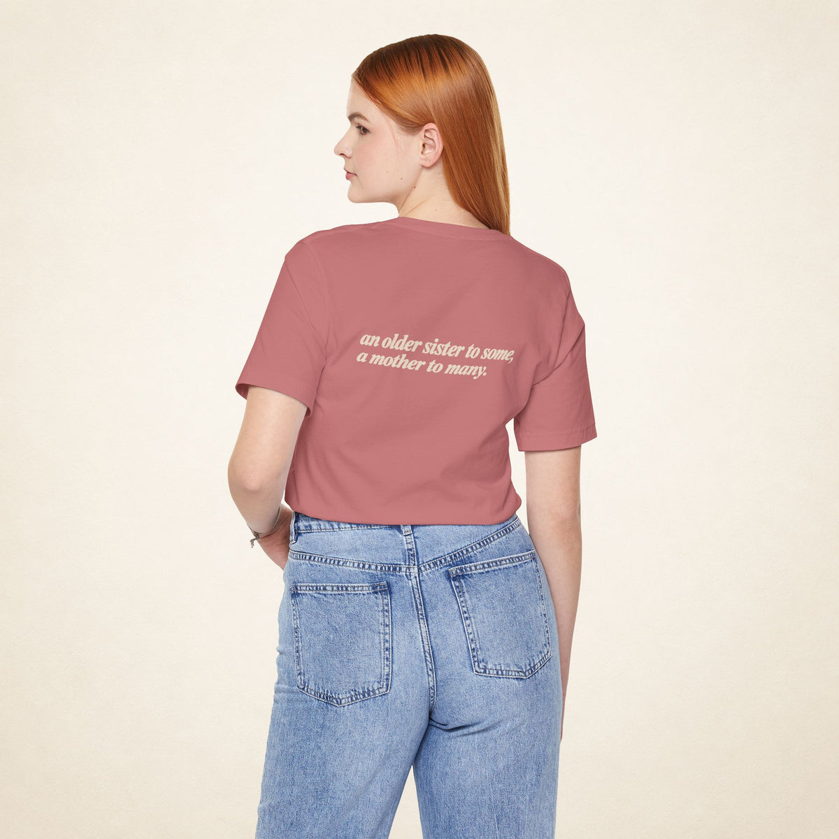 Model wearing the Mauve ATE Filipino T-shirt from behind, with the message “an older sister to some, a mother to many.”