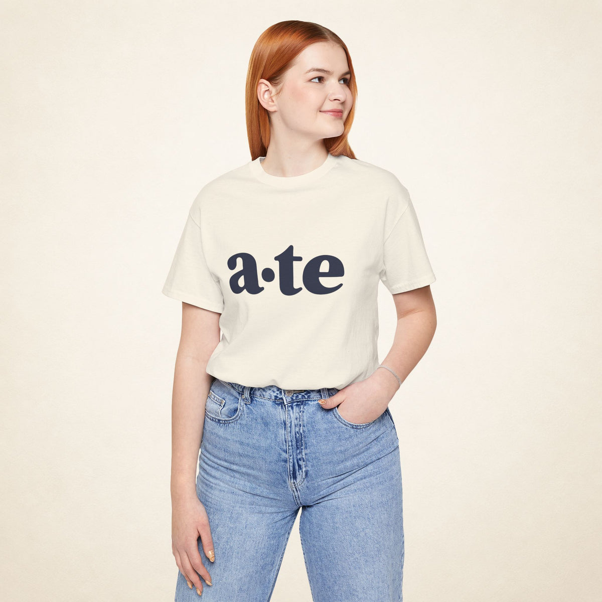 Model wearing the Natural ATE Filipino T-shirt from MadeInPinas, front view showing a·te lettering.