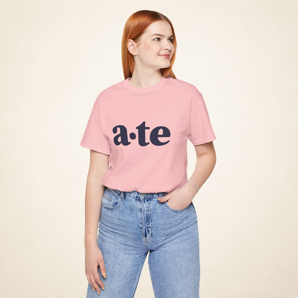 Model wearing the Pink ATE Filipino T-shirt from MadeInPinas, front view showing a·te lettering.