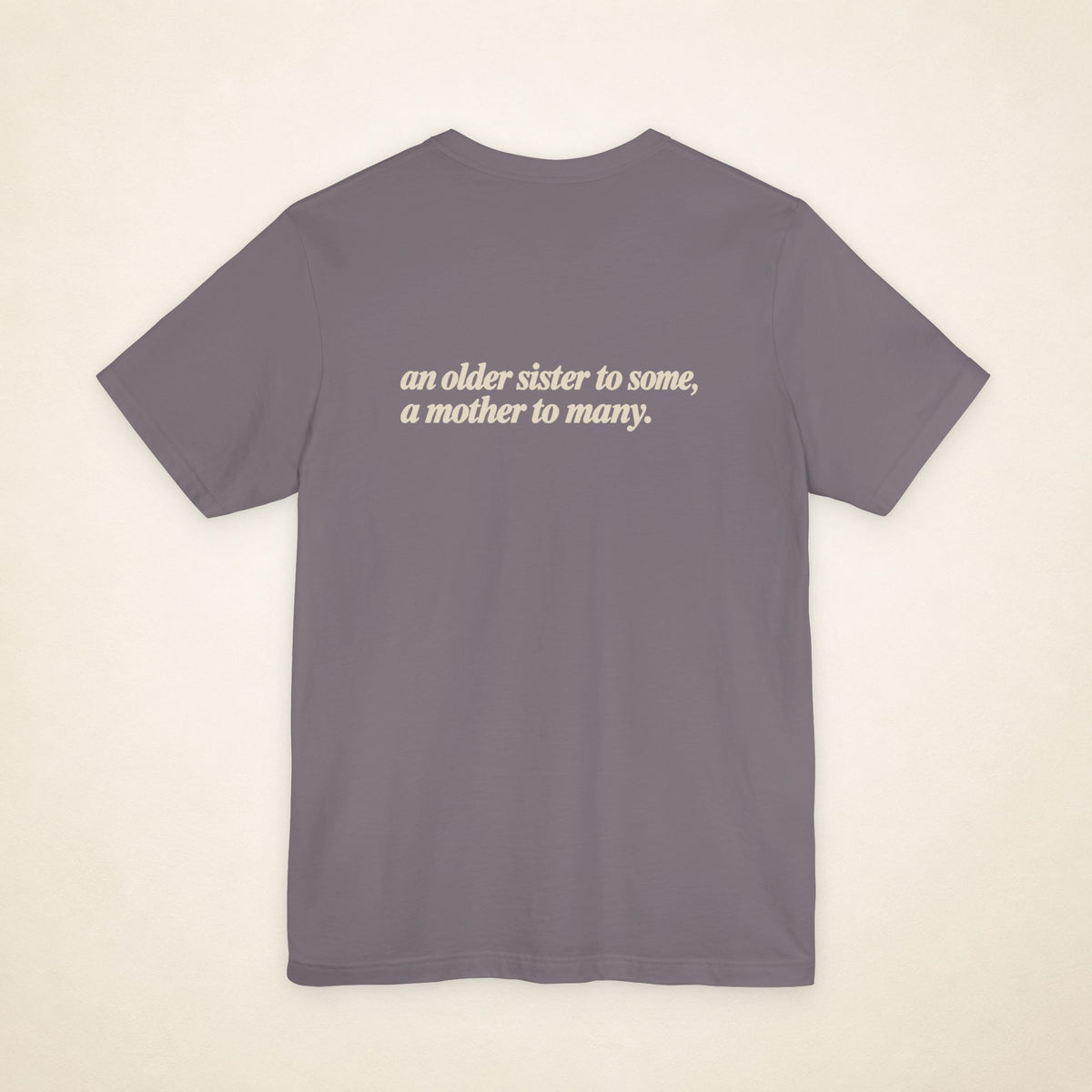 Storm ATE Filipino T-shirt, flat-lay back view with the message “an older sister to some, a mother to many.”