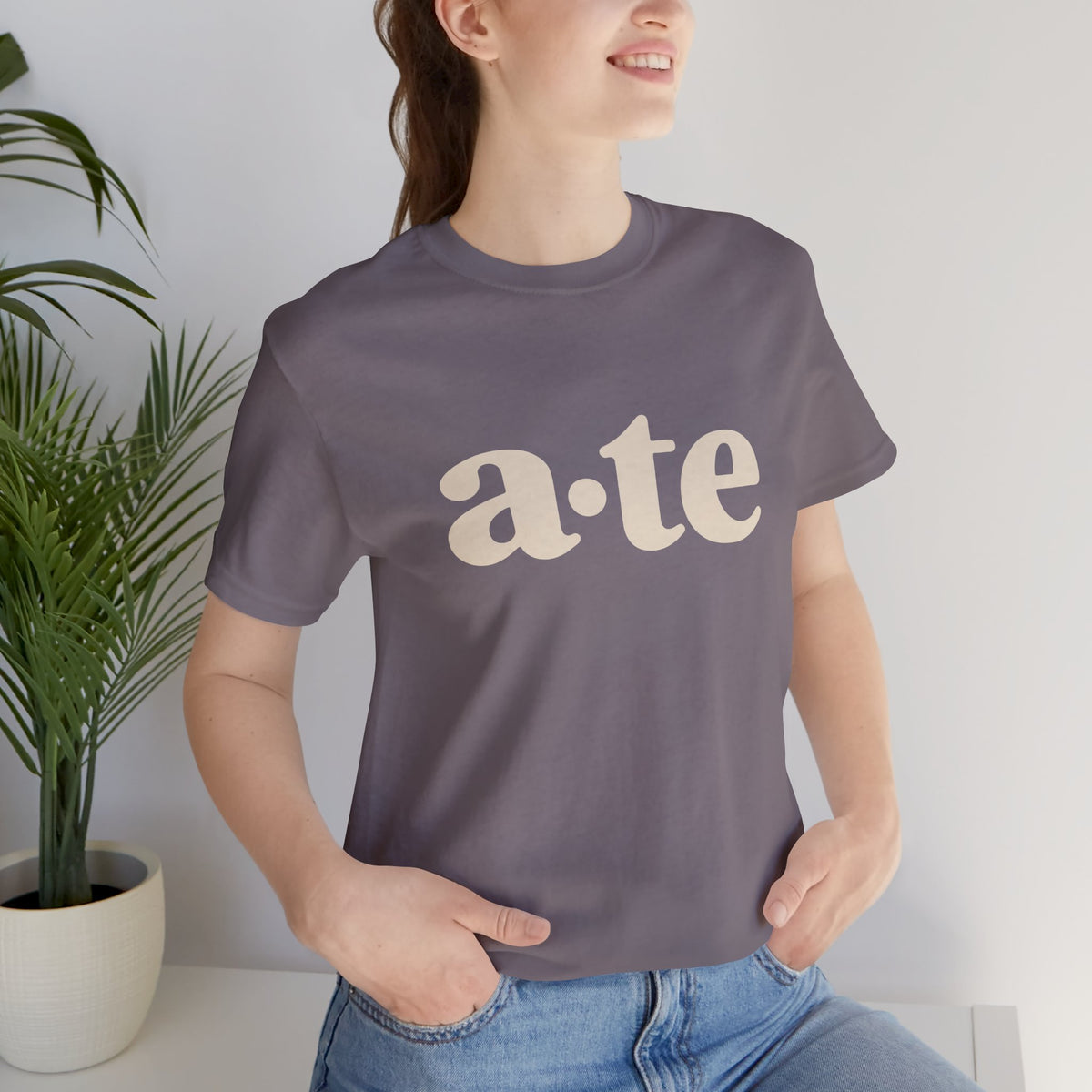 Lifestyle front view of a model wearing the Storm ATE Filipino T-shirt with minimalist a·te lettering.