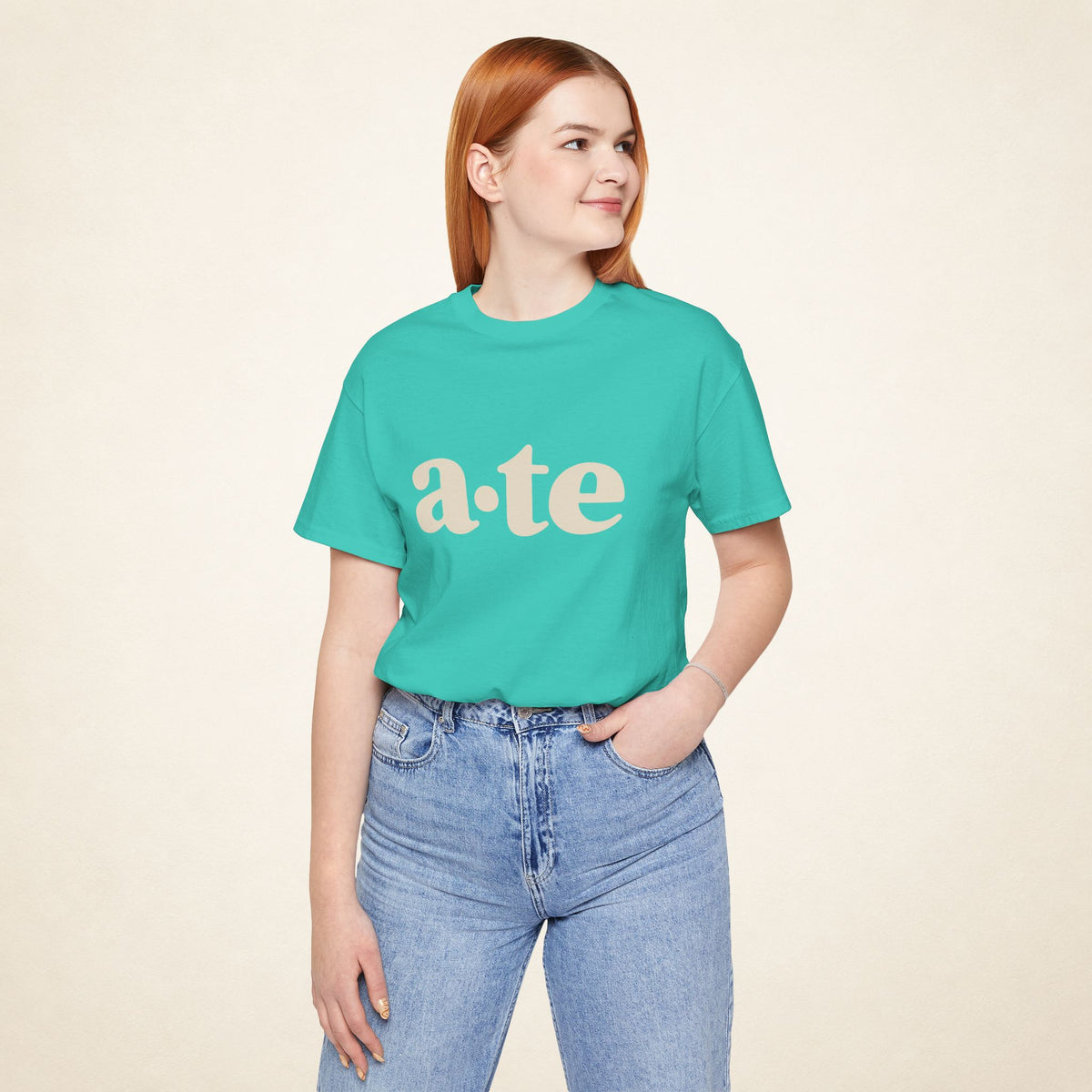 Model wearing the Teal ATE Filipino T-shirt from MadeInPinas, front view showing a·te lettering.