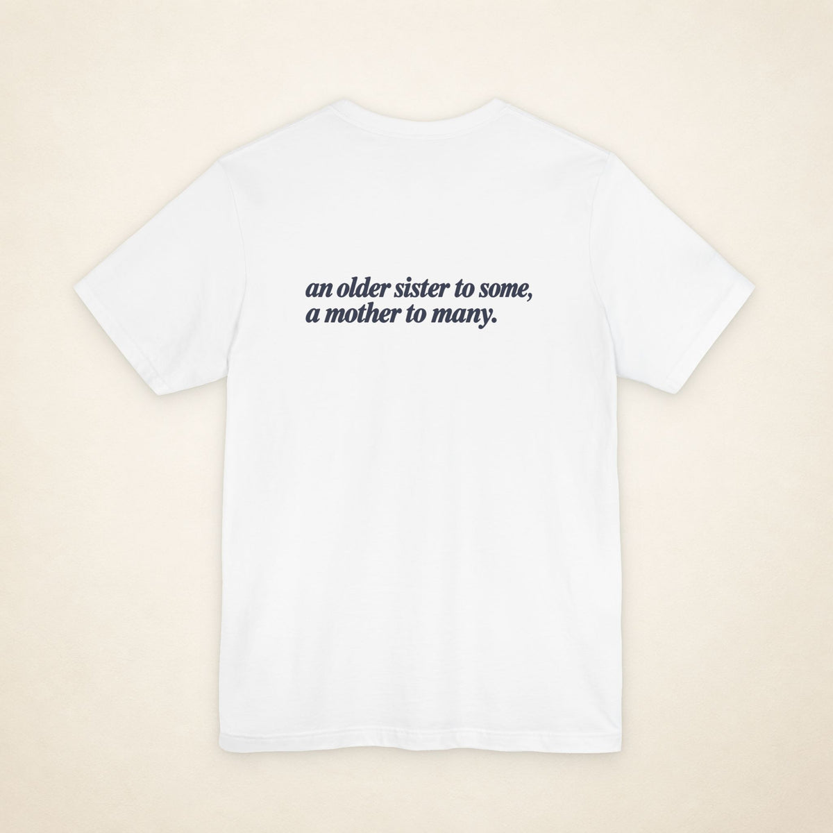 White ATE Filipino T-shirt, flat-lay back view with the message “an older sister to some, a mother to many.”