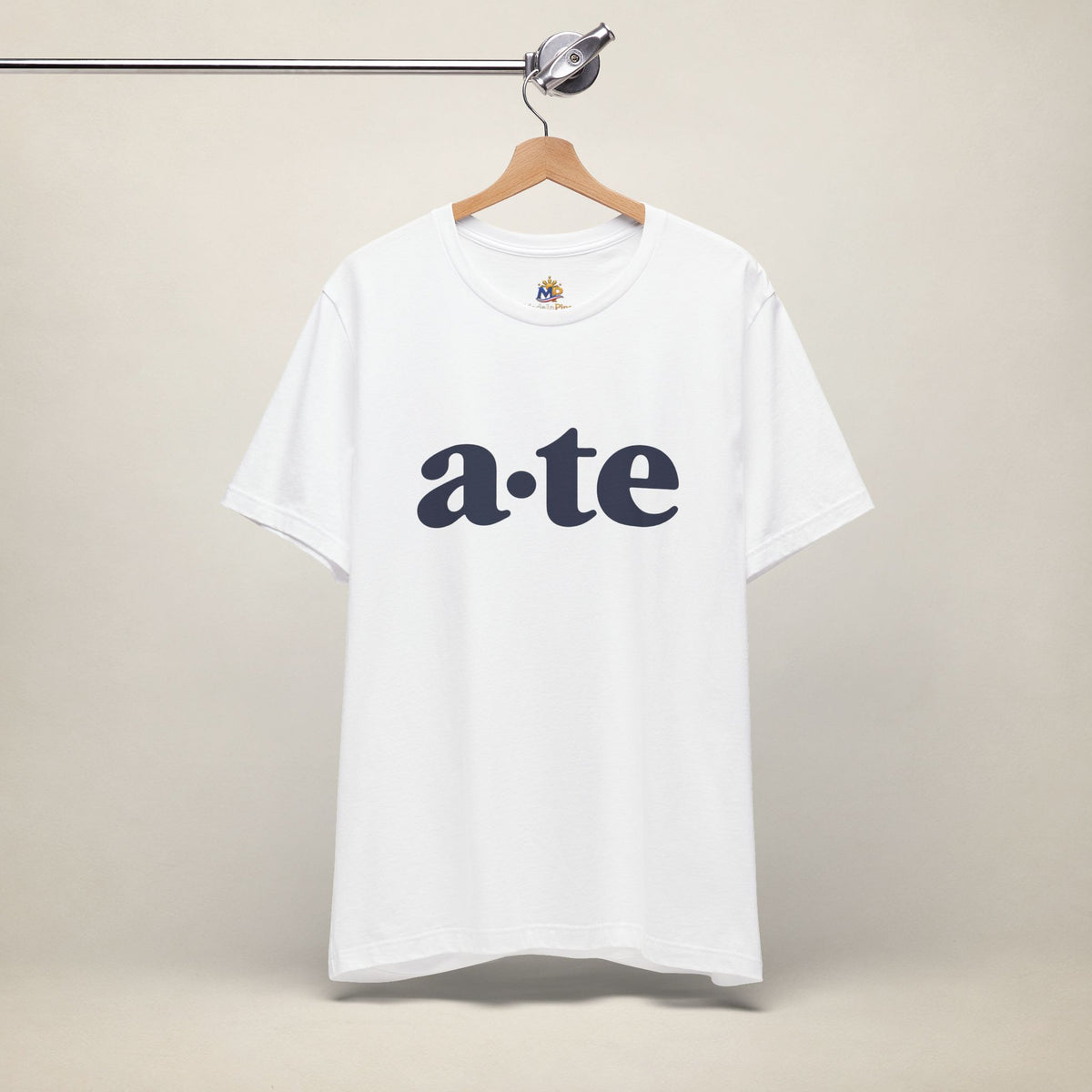 White MadeInPinas ATE Filipino T-shirt on a hanger, front view with minimalist a·te lettering.