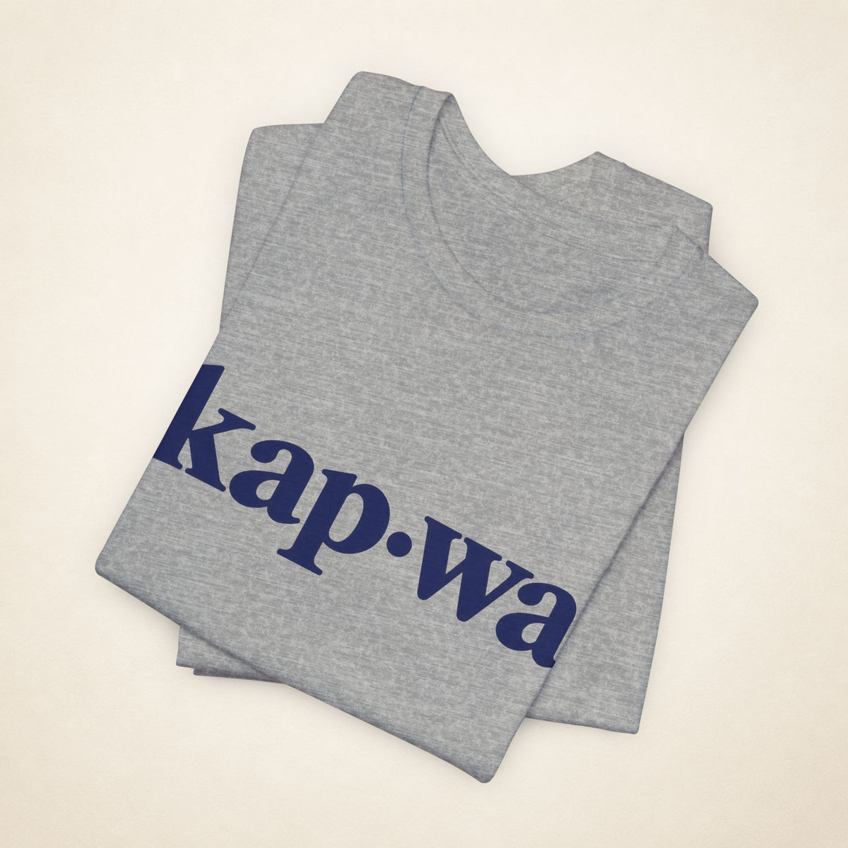 Folded Athletic Heather MadeInPinas KAPWA T-shirt with the kap·wa front print visible.