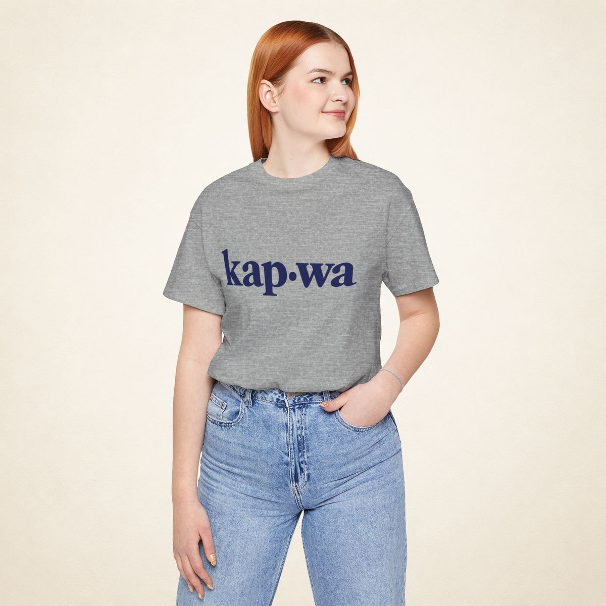 Model wearing the Athletic Heather KAPWA Filipino graphic tee, front view with kap·wa typography.