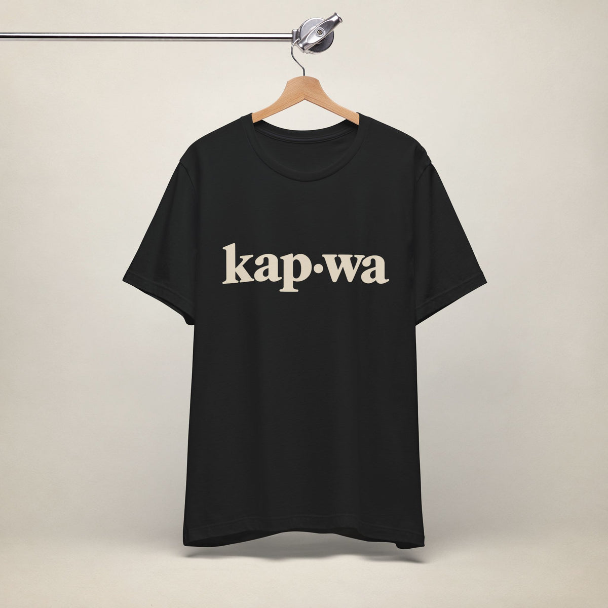 MadeInPinas KAPWA Filipino heritage T-shirt in Black, hanging front view with minimalist kap·wa lettering.