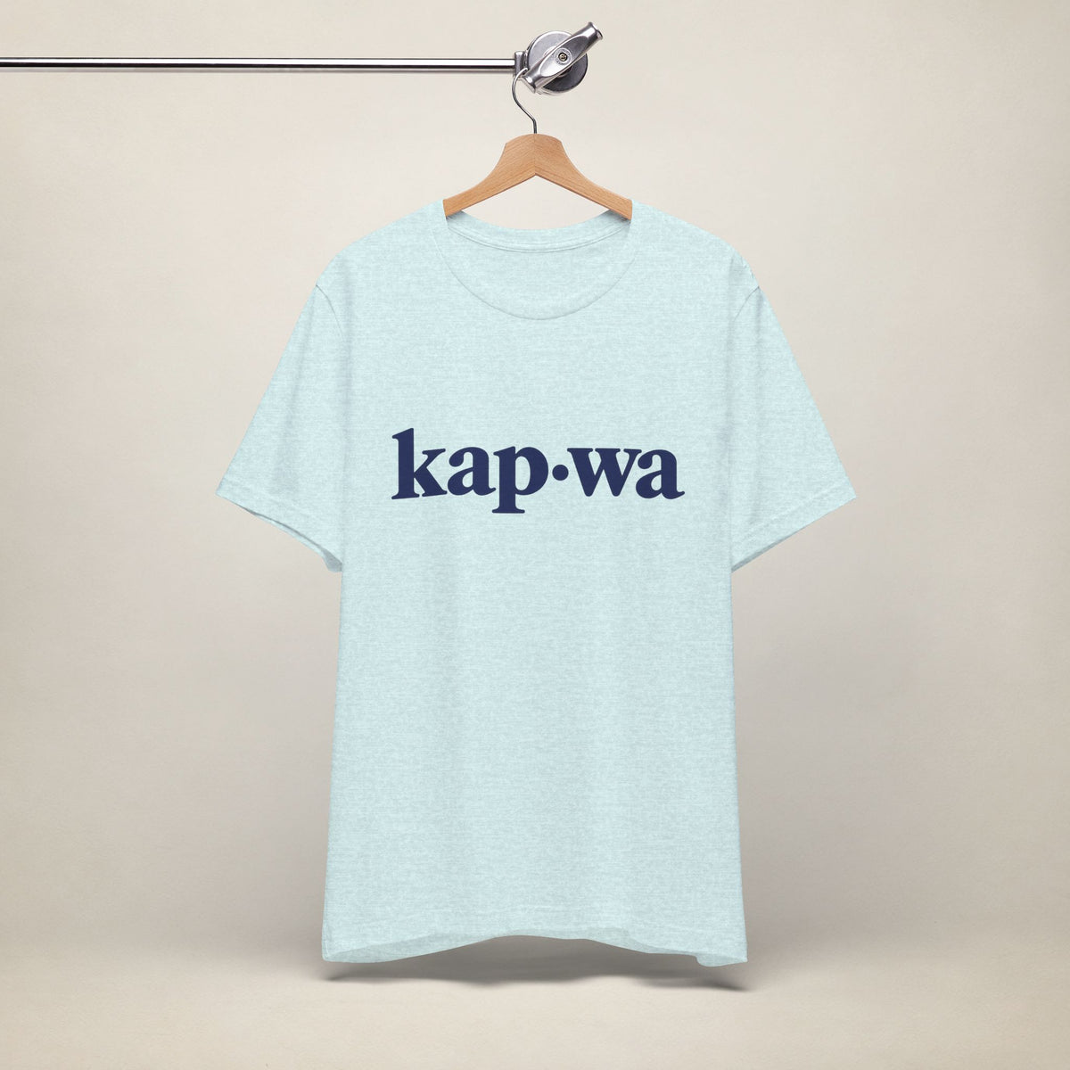 MadeInPinas KAPWA Filipino heritage T-shirt in Heather Prism Ice Blue, hanging front view with minimalist kap·wa lettering.
