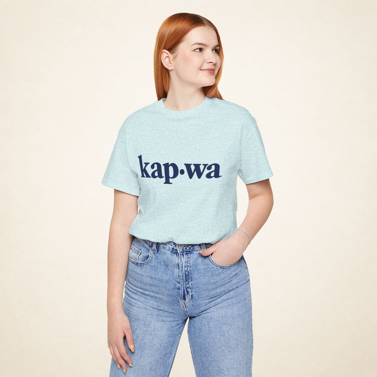 Model wearing the Heather Prism Ice Blue KAPWA Filipino graphic tee, front view with kap·wa typography.
