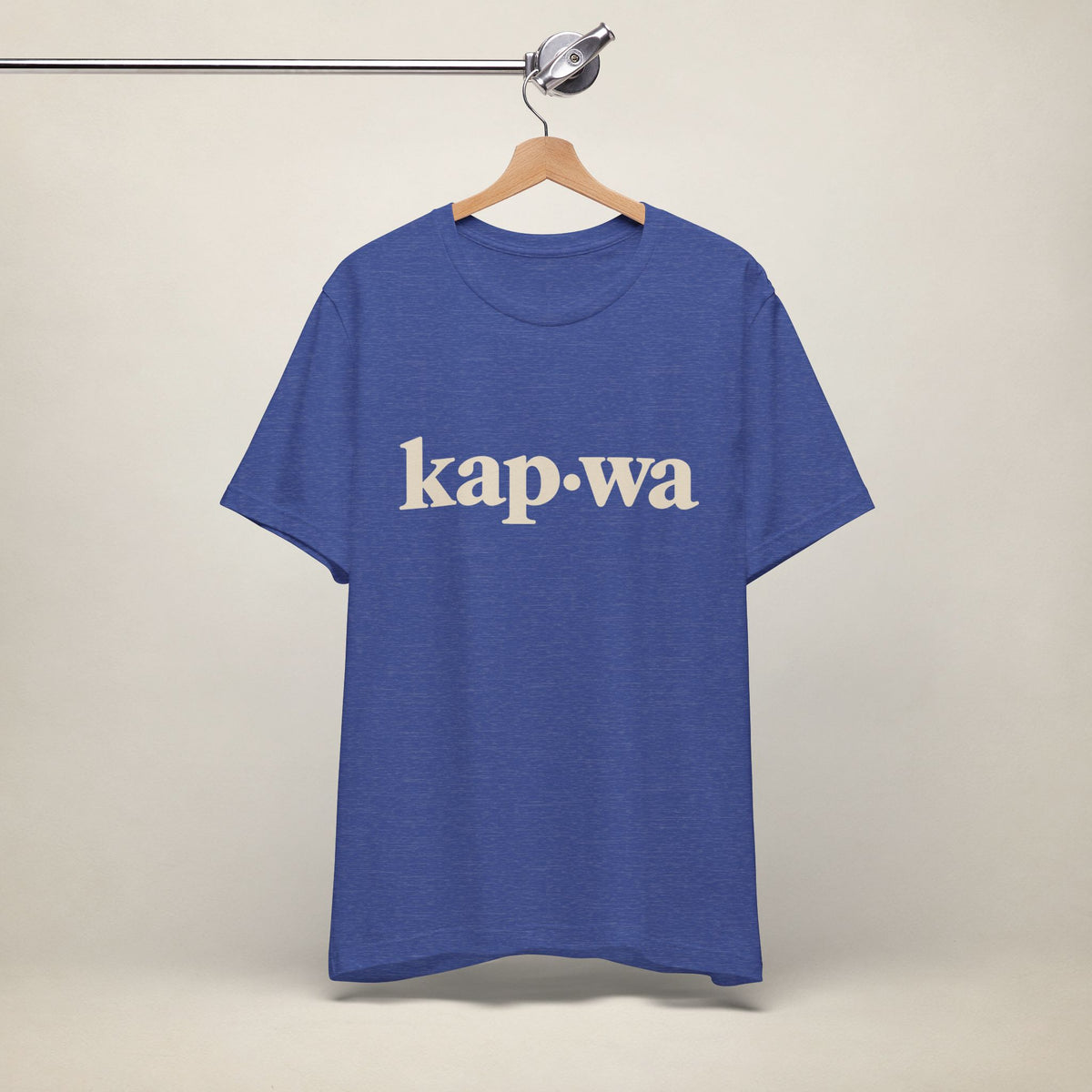 MadeInPinas KAPWA Filipino heritage T-shirt in Heather True Royal, hanging front view with minimalist kap·wa lettering.