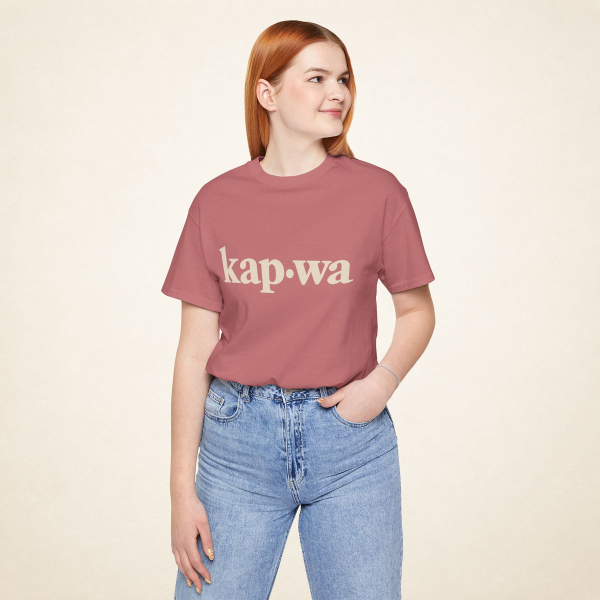 Model wearing the Mauve KAPWA Filipino graphic tee, front view with kap·wa typography.