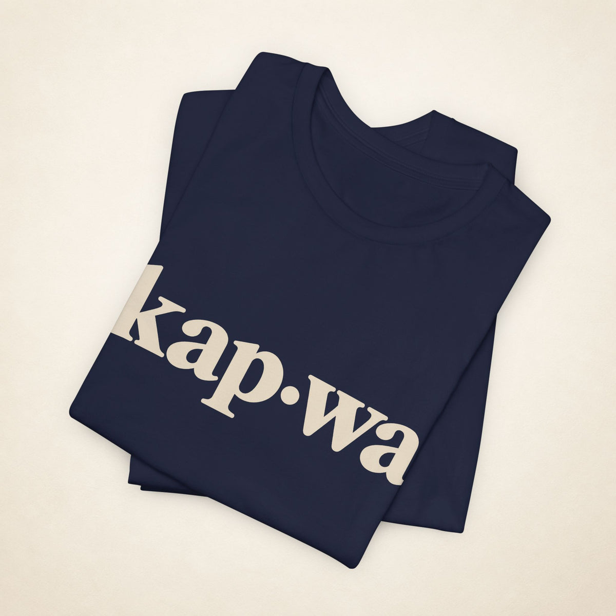 Folded Navy MadeInPinas KAPWA T-shirt with the kap·wa front print visible.