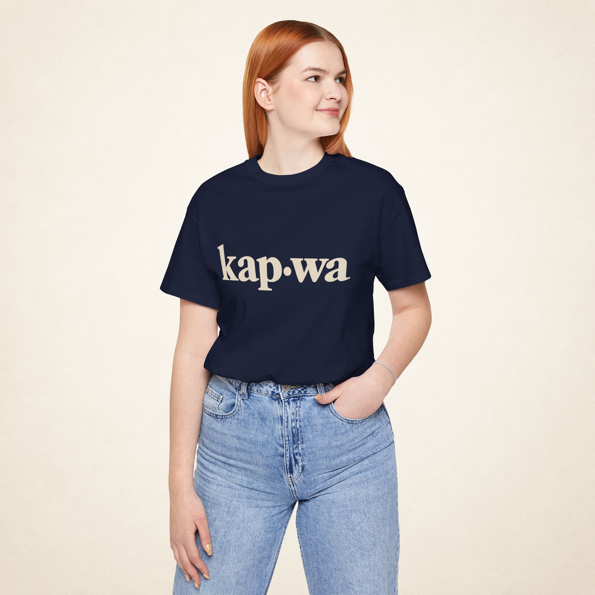 Model wearing the Navy KAPWA Filipino graphic tee, front view with kap·wa typography.