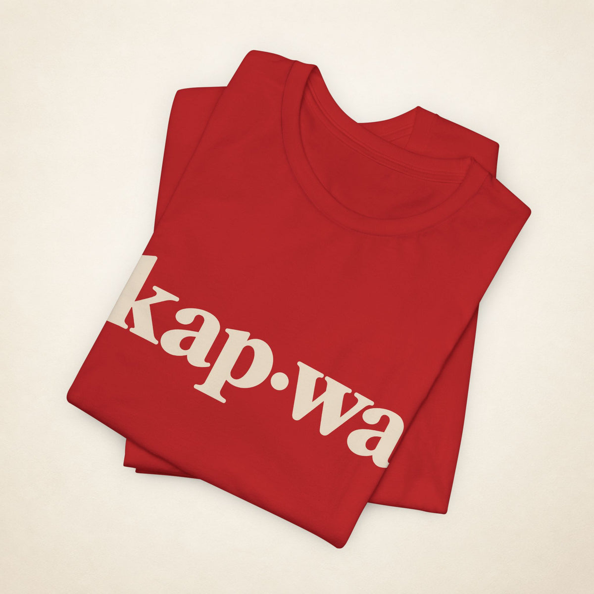 Folded Red MadeInPinas KAPWA T-shirt with the kap·wa front print visible.