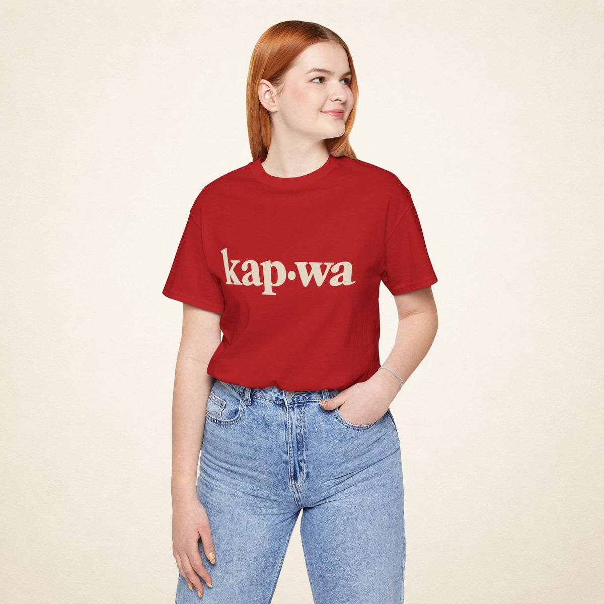 Model wearing the Red KAPWA Filipino graphic tee, front view with kap·wa typography.