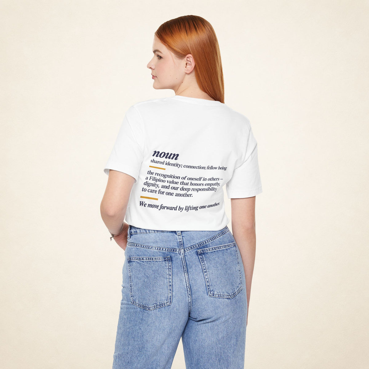 Model wearing the White KAPWA T-shirt from behind, showing the shared humanity back design.