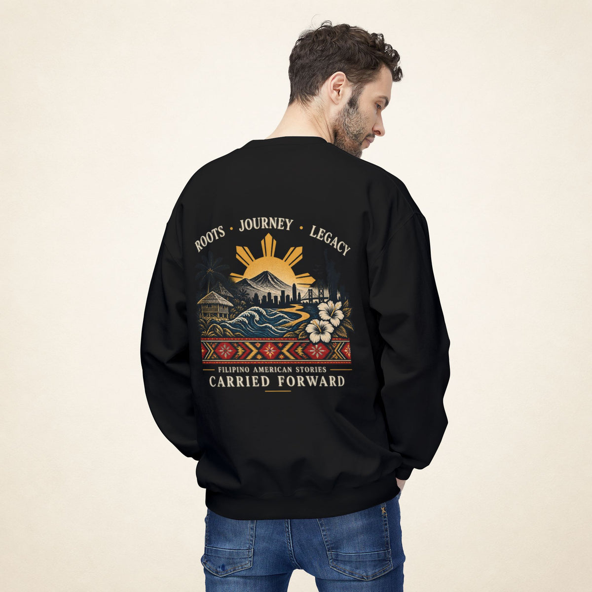 Male model photographed from behind wearing a black PAGSULONG Filipino American heritage sweatshirt, displaying the colorful heritage-inspired back design.